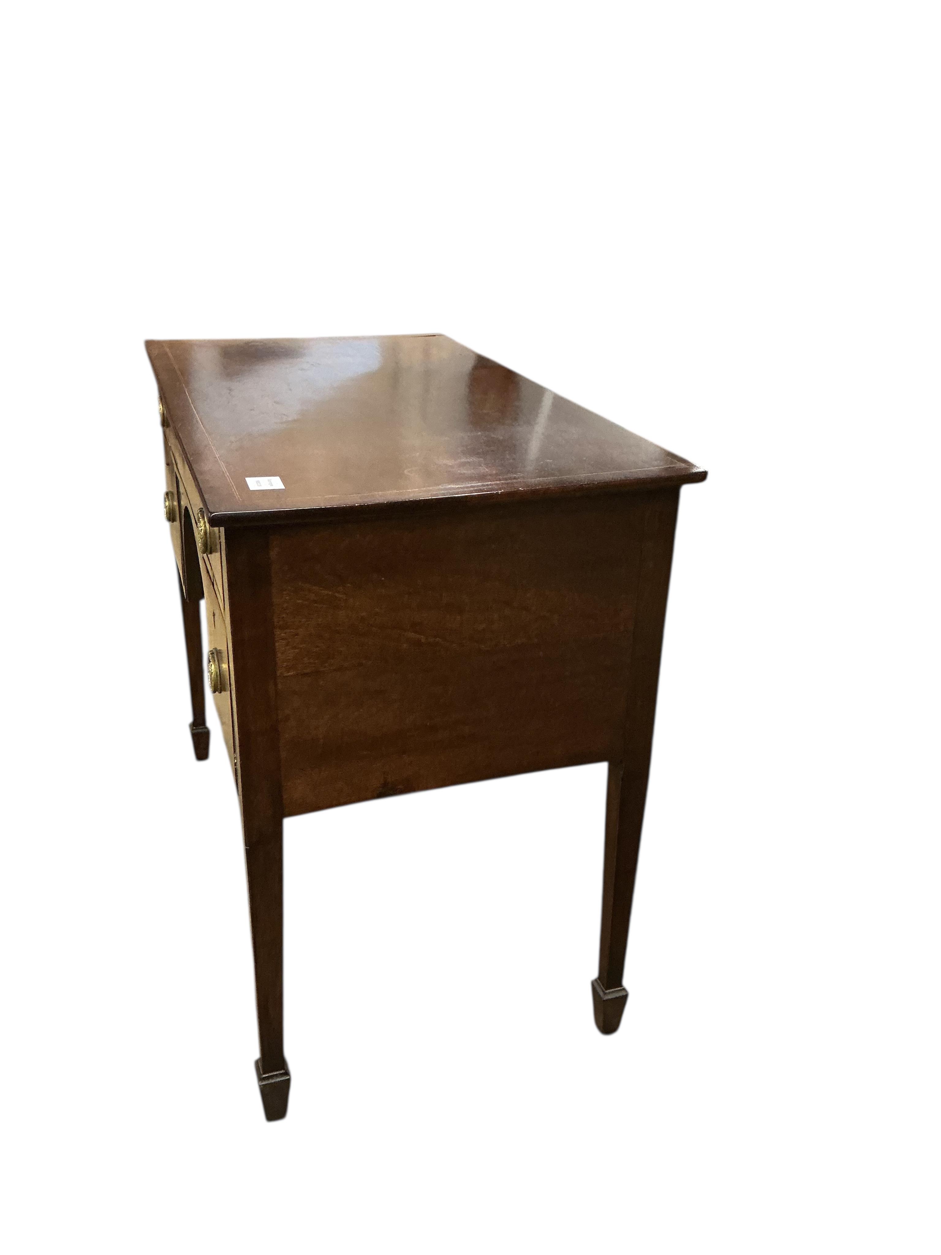 A George III rectangular inlaid mahogany kneehole dressing table, fitted one long and two short drawers, width 91cm, depth 49cm, height 75cm